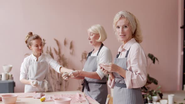 Blonde Woman in Pottery Workshop