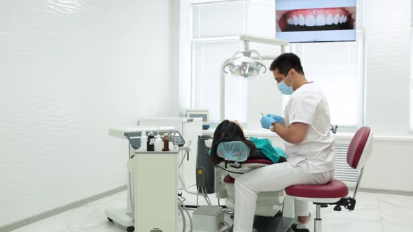 Cute Young Girl Is Being Examined By the Dentist