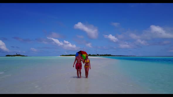 Two lovers happy together on paradise sea view beach holiday by blue green sea with white sandy back