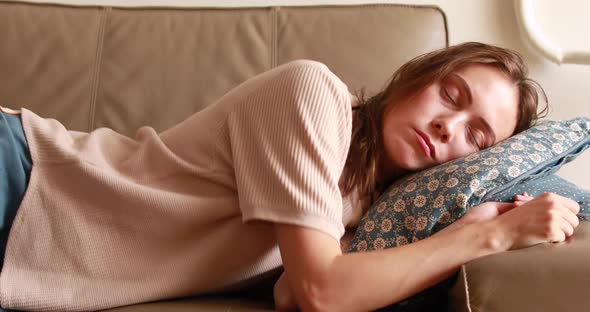 Young Woman Sleeping on Sofa