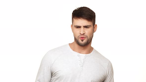 Strong Caucasian Guy in Sweatshirt Standing on White Background Approving and Showing Ok on White