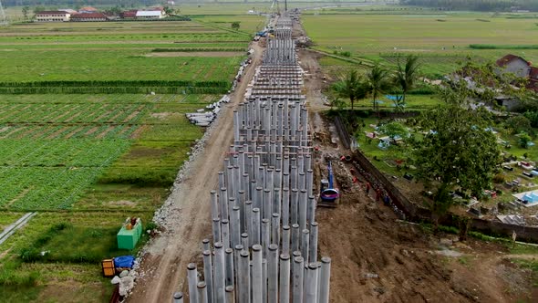 Pylons for monorail road construction in Kulon Progo rural area, Yogyakarta in Indonesia. Aerial Aer