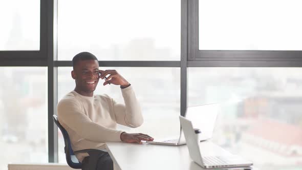 Dark-skinned Businessman Focused on Work Issues