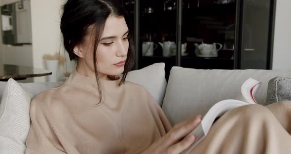 Attractive Lady Enjoying Spending Leisure Time with Read Modern Novel Literature