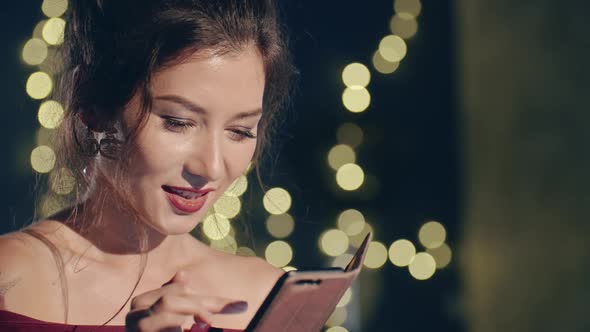 Close Up Portrait of Young Asian Girl Browsing As or Social Media Posts Alone