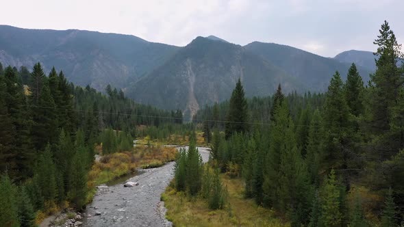 Rising aerial view over the Madison River winding through the landscape