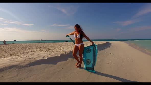 Girl loves life on beautiful lagoon beach vacation by transparent ocean and white sand background of