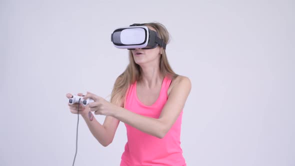 Blonde Woman Playing Games and Using Virtual Reality Headset