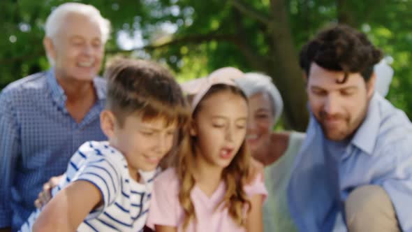 Multi-generation family taking selfie on mobile phone