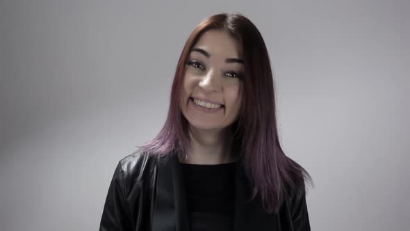 Portrait of Young Woman Changing Emotions From Laugh To Being Surprised