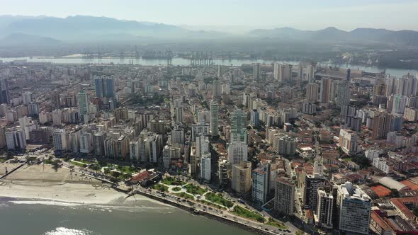 Panning wide landscape of coast city of Santos state of Sao Paulo Brazil.