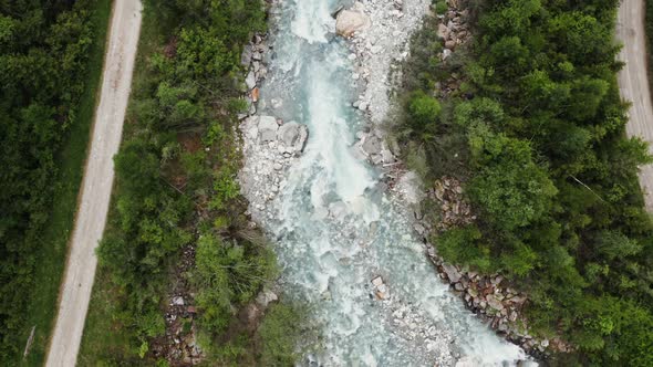 Top View of a Raging Mountain River Flowing at the Foot of the Alps