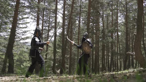 Two soldiers undergoing combat training in the jungle.