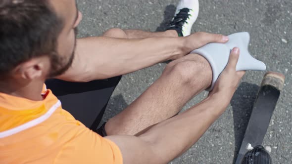 Disabled Runner Donning a Shrinker Sock