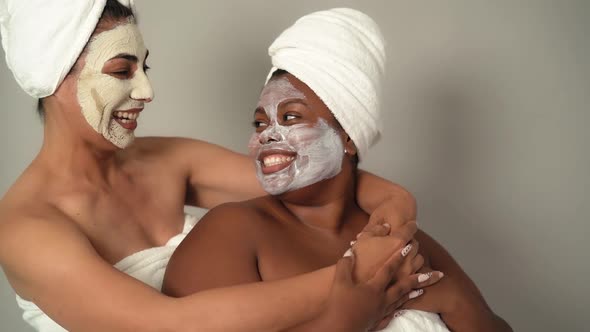 Happy multiracial women with different age and body size having skin care spa day