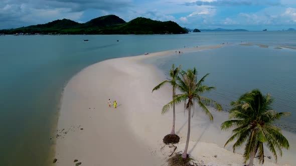 Couple Men and Women Walking on the Beach at the Island Koh Yao Yai Thailand Beach with White Sand