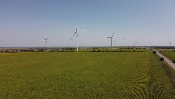 Aerial drone view of a flying over the wind turbine