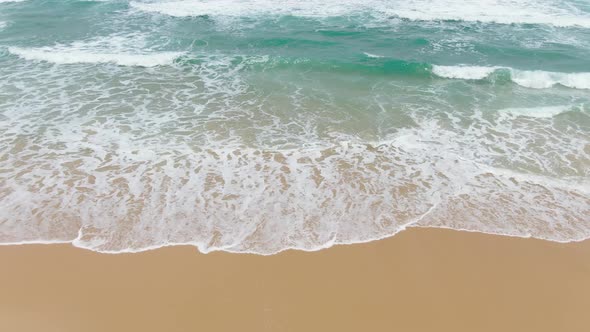 Top view Beautiful waves crystal clear water and white beach.Drone shots.