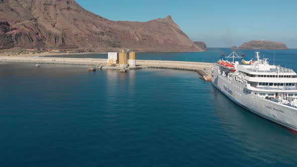 Aerial along anchored crossing islands ferry boat, Portuguese Island