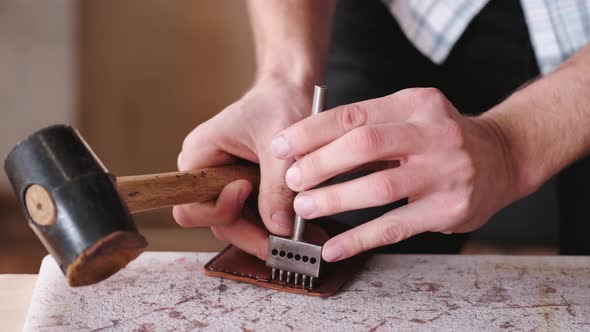 The Tanner Is Stitching a Hand-made Leather Wallet