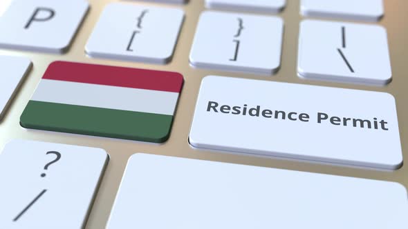 Residence Permit Text and Flag of Hungary on Computer Keyboard