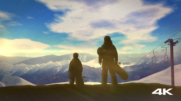 Family With Snowboards At The Top Of The Mountainside