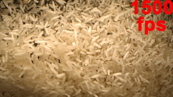 Basmati Rice Is Tossed Up In The Air Falling In Slow Motion