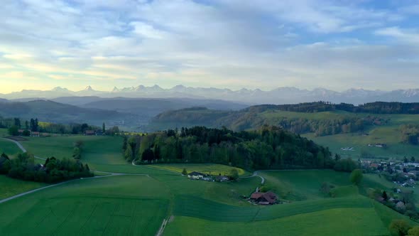 Timelapse over Bolligen near Bern the capital of Switzerland with the Alps in the background