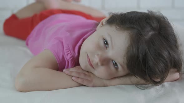 Portrait of a baby in bed. 