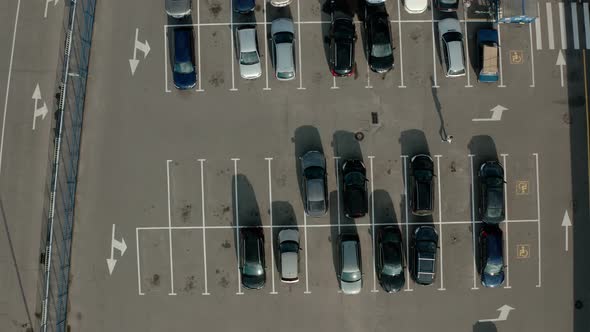 Top Aerial Drone View Car Driving and Parked Free Parking Space. View From Above Flying Drone Cars