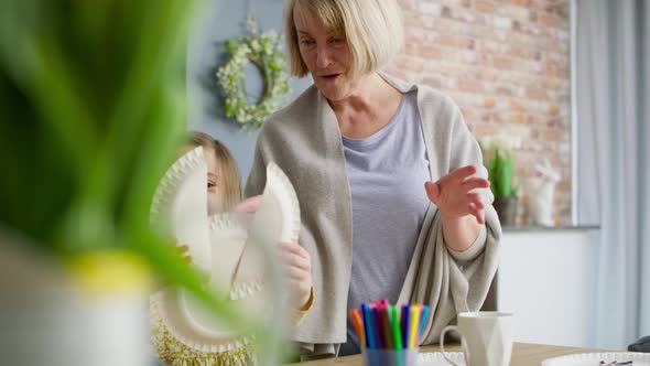 Video of grandma admiring with her granddaughter's handmade Easter bunny.