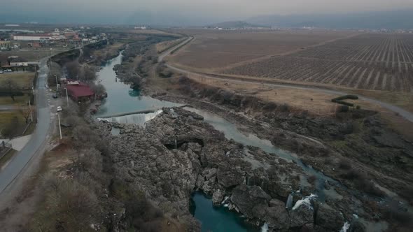 Aerial view of Niagara Waterfall on the river Cijevna on cloudy weather in Podgorica, Montenegro