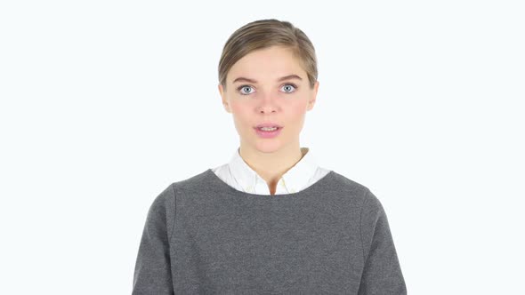 Gesture of Silence By Woman Finger on White Background