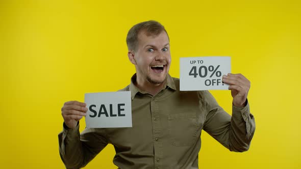 Attractive Man Showing Sale Word and Showing Up To 40 Percent Off Inscription. Black Friday Concept