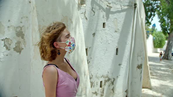 a Woman in a Protective Mask in Profile a Girl Spends Her Vacation Enjoying the Architecture of an