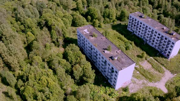 Aerial View of Abandoned and Destroyed Buildings From the Times of the USSR in a Green Picturesque