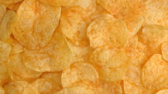 Background of Potato Chips Rotating Close Up