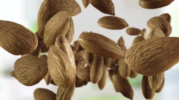 Flying of Almonds in Kitchen Background