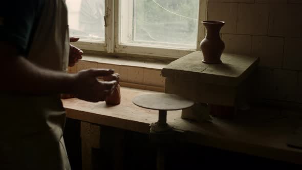 Unknown Master Putting Freshmade Clay Jar on Board