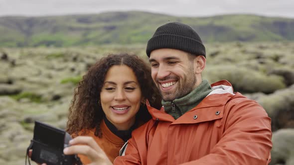 Smiling Happy Couple Posing for Selfie in Icelandic Landscape