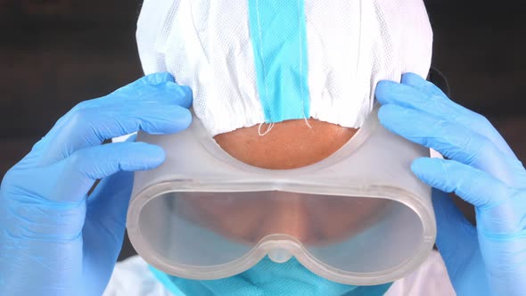 Portrait of a Male Doctor Wearing PPE Looking Sad 