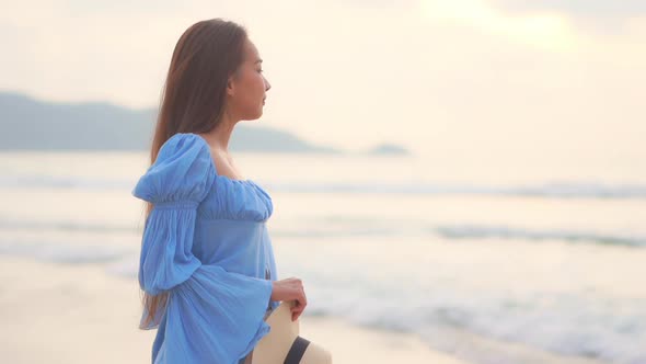 Asian woman enjoy around beautiful beach sea ocean