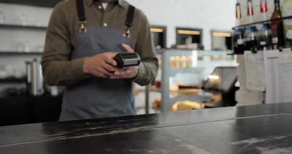 Woman Paying with Nfc Technology By Smartwatch Contactless on Terminal in Modern Cafe