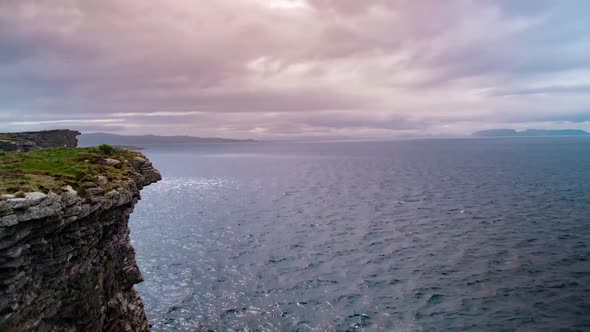 Cinematic timelapse of scottish cliffs during golden hour