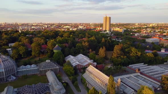 Green park big skyscraperTranquil aerial view flight flyover drone footage, botanischer garten Berl