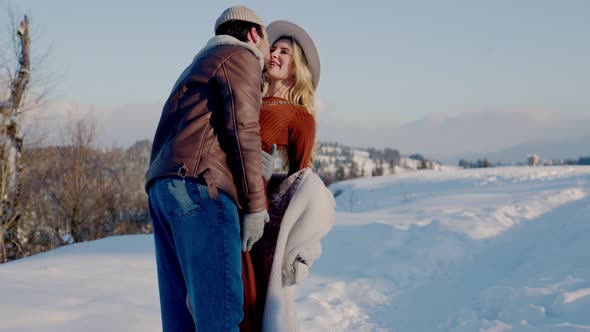 Couple in Winter in the Mountains