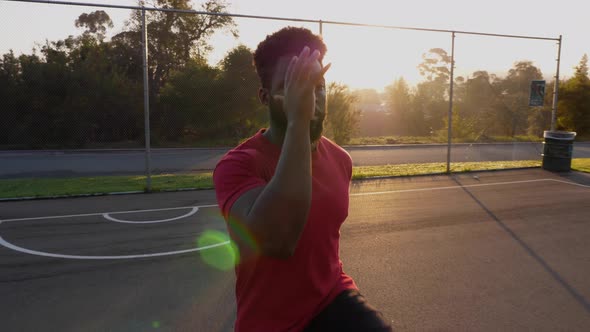 African American man stretching and warming up before his workout