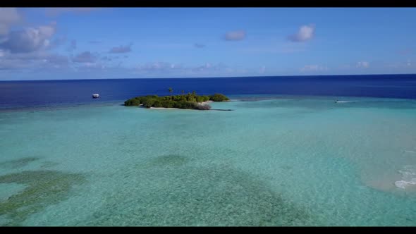 Aerial flying over sky of marine resort beach adventure by aqua blue lagoon with white sand backgrou