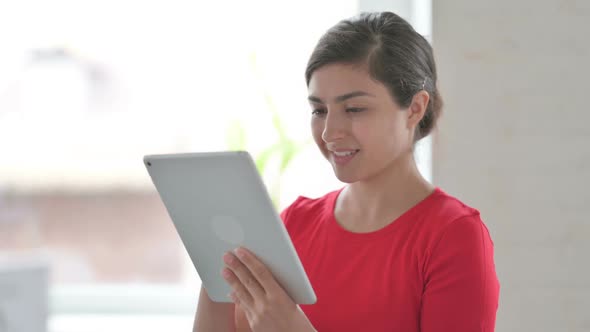 Indian Woman Using Digital Tablet Browsing Internet