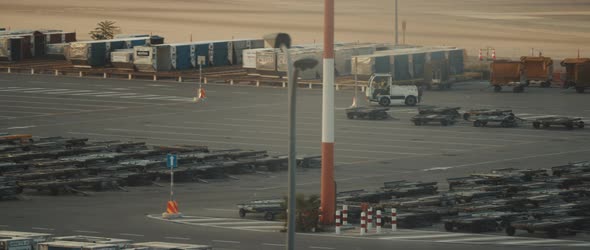 Man driving a small service baggage car on a runway of the airport, BMPCC 4K